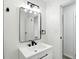 Bathroom features sleek vanity with black hardware and modern lighting at 4221 Haverhill Dr, Anderson, IN 46013