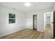 This bedroom features wood floors, closet, and natural lighting at 4221 Haverhill Dr, Anderson, IN 46013
