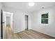 Bedroom with view to hallway, wood floors, and a closet at 4221 Haverhill Dr, Anderson, IN 46013