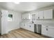 Modern kitchen with white cabinets, stainless steel appliances, and a quartz countertop at 4221 Haverhill Dr, Anderson, IN 46013