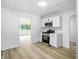 Modern kitchen design with white cabinets, stainless steel appliances, and an open layout at 4221 Haverhill Dr, Anderson, IN 46013