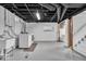 Basement laundry area featuring a washer, dryer, sink, and storage at 4732 N Kenwood Ave, Indianapolis, IN 46208