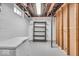 Unfinished basement area with shelving, freezer, and exposed ceiling at 4732 N Kenwood Ave, Indianapolis, IN 46208