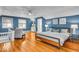 Large bedroom features hardwood floors, soft lighting, and a comfortable seating area at 4732 N Kenwood Ave, Indianapolis, IN 46208
