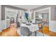 Open dining room showcases hardwood floors and seamless flow to the modern kitchen and living spaces at 4732 N Kenwood Ave, Indianapolis, IN 46208