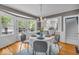 Cozy dining area with hardwood floors, natural light, and views of the kitchen and outdoors at 4732 N Kenwood Ave, Indianapolis, IN 46208