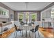 Charming dining room with hardwood floors, a chandelier, and a view to the kitchen at 4732 N Kenwood Ave, Indianapolis, IN 46208