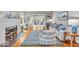 Bright living room boasts hardwood floors, a decorative fireplace, and stylish furnishings at 4732 N Kenwood Ave, Indianapolis, IN 46208