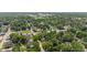 A beautiful aerial view that captures the home's setting within a lush, green, tree-filled neighborhood at 4742 Kingsley Dr, Indianapolis, IN 46205