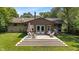 Backyard featuring a wooden deck, green grass, and chairs at 4742 Kingsley Dr, Indianapolis, IN 46205
