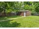 Backyard featuring a shed and green grass at 4742 Kingsley Dr, Indianapolis, IN 46205