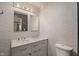 Modern bathroom featuring double sinks, marble countertop, and a sleek design at 4742 Kingsley Dr, Indianapolis, IN 46205