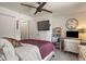Comfortable bedroom featuring a ceiling fan, a cozy chair, and a large bed at 4742 Kingsley Dr, Indianapolis, IN 46205