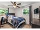 Comfortable bedroom featuring neutral walls, carpet, and natural light from the windows at 4742 Kingsley Dr, Indianapolis, IN 46205