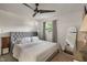 Cozy bedroom featuring plush carpeting, a large window, neutral decor, and a comfortable bed at 4742 Kingsley Dr, Indianapolis, IN 46205