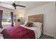 Inviting bedroom with a cozy bed, large window, and warm natural light at 4742 Kingsley Dr, Indianapolis, IN 46205