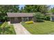 Charming home with a well-maintained lawn, beautiful front garden, and a welcoming exterior at 4742 Kingsley Dr, Indianapolis, IN 46205
