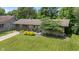 Charming exterior of a single-story home, featuring a well-manicured lawn and beautiful landscaping at 4742 Kingsley Dr, Indianapolis, IN 46205