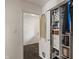 Hallway with a marble-like tile floor and a closet with drawers and shelving at 4742 Kingsley Dr, Indianapolis, IN 46205
