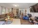 Cozy living room with hardwood floors, wood-burning stove, comfortable seating, and an open floor plan at 4742 Kingsley Dr, Indianapolis, IN 46205