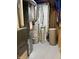 Utility area with water heater and filter, furnace, and other equipment on gray floor at 4760 Winterberry Pl, Columbus, IN 47201