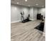 Spacious basement featuring exercise equipment, modern flooring, and ample workout space at 4760 Winterberry Pl, Columbus, IN 47201