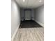 Functional basement space featuring workout equipment and modern flooring at 4760 Winterberry Pl, Columbus, IN 47201