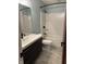 Bathroom features a vanity with modern fixtures and a shower with a tub at 4760 Winterberry Pl, Columbus, IN 47201