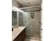 Bathroom with glass shower, dual sink vanity, and recessed lighting at 4760 Winterberry Pl, Columbus, IN 47201