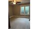 Bedroom with neutral carpeting, a ceiling fan, and a window with blinds at 4760 Winterberry Pl, Columbus, IN 47201