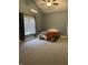 Bedroom with neutral carpeting and one bed situated under a window with a peaked ceiling at 4760 Winterberry Pl, Columbus, IN 47201