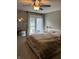 Bright bedroom with access to an outdoor pool area and a full-length mirror at 4760 Winterberry Pl, Columbus, IN 47201