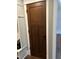 Stylish brown door with modern black handle complementing the home's interior design at 4760 Winterberry Pl, Columbus, IN 47201