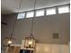 An interior view showcasing modern lighting fixtures and upper clerestory windows providing natural light at 4760 Winterberry Pl, Columbus, IN 47201