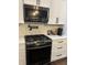 Featuring a modern kitchen with stainless steel oven and microwave at 4760 Winterberry Pl, Columbus, IN 47201