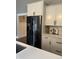 Features stainless steel refrigerator, white cabinets, and countertops at 4760 Winterberry Pl, Columbus, IN 47201
