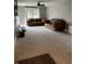 Comfortable living room featuring neutral walls, a ceiling fan and plush carpet at 4760 Winterberry Pl, Columbus, IN 47201