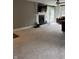 Spacious living room showcasing a cozy fireplace and a door to the outside deck at 4760 Winterberry Pl, Columbus, IN 47201