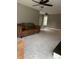 Comfortable living room featuring neutral walls, a ceiling fan and plush carpet at 4760 Winterberry Pl, Columbus, IN 47201