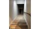View of staircase with wood-look steps and white risers, leading to the lower level at 4760 Winterberry Pl, Columbus, IN 47201