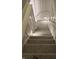 Carpeted staircase with white wood trim and a modern design aesthetic at 4760 Winterberry Pl, Columbus, IN 47201
