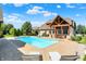 Beautiful pool and landscaped backyard provide the perfect space for outdoor living at 4931 Kerrington Blvd, Bargersville, IN 46106