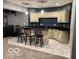 Basement bar area offers bar seating, a sink, and cabinets for storage perfect for entertaining at 4931 Kerrington Blvd, Bargersville, IN 46106
