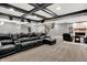 Finished basement boasting a large leather couch and a cozy seating area by the fireplace at 4931 Kerrington Blvd, Bargersville, IN 46106