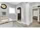 An exquisite, grey-walled bathroom boasts a glass shower and stylish, granite countertops at 4931 Kerrington Blvd, Bargersville, IN 46106