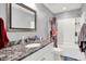Updated bathroom with granite countertop, framed mirror, vanity, and a shower-tub with shower curtain at 4931 Kerrington Blvd, Bargersville, IN 46106