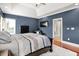 A blue-walled bedroom provides great lighting and a view of the outside at 4931 Kerrington Blvd, Bargersville, IN 46106