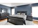 This bedroom features dark-colored walls, a large bed, and well-crafted dressers at 4931 Kerrington Blvd, Bargersville, IN 46106