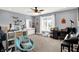 Spacious bedroom featuring a large window, a comfortable chair, and a desk at 4931 Kerrington Blvd, Bargersville, IN 46106