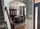 Formal dining room is accented by a chandelier and windows for a bright and inviting atmosphere at 4931 Kerrington Blvd, Bargersville, IN 46106